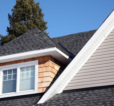 A rooftop featuring a window and a chimney